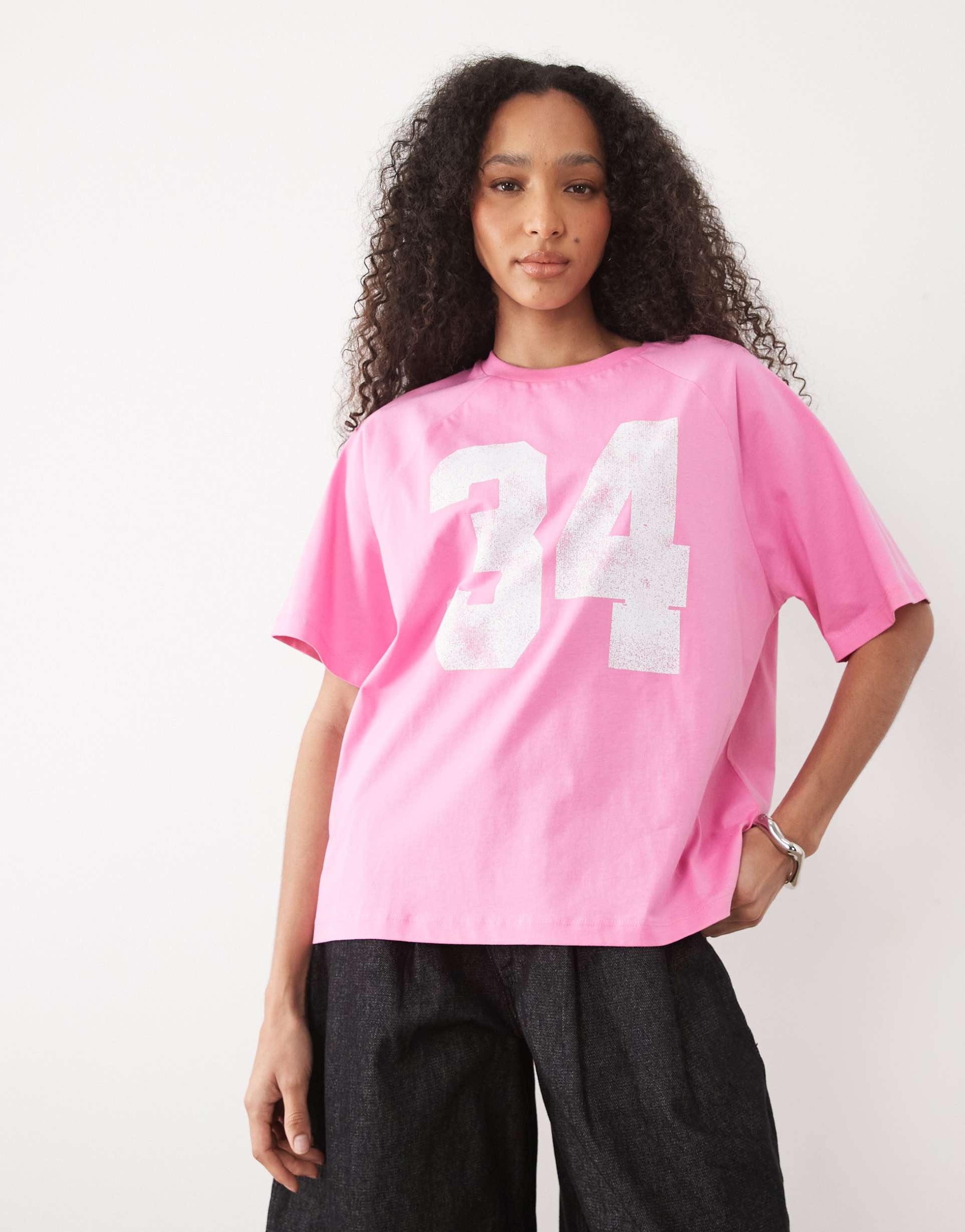 asos design oversized raglan football t-shirt with 34 varsity graphic in light pink