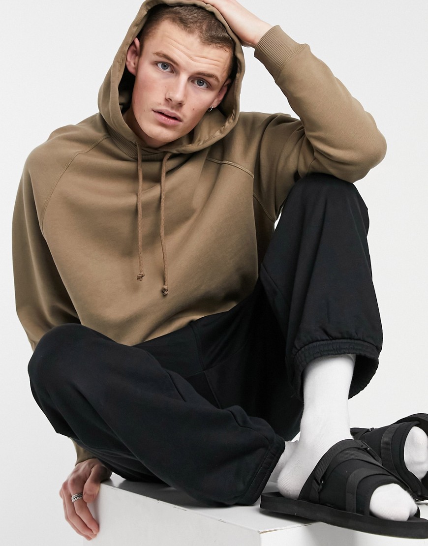 ASOS DESIGN oversized raglan hoodie with cross over neck in brown