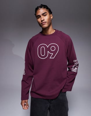 Asos Design Oversized Raglan Long Sleeve T-shirt With Flocked Sports Graphic In Burgundy