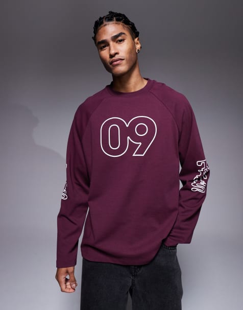 ASOS DESIGN oversized raglan long sleeve t-shirt with flocked sports graphic in burgundy - view 1