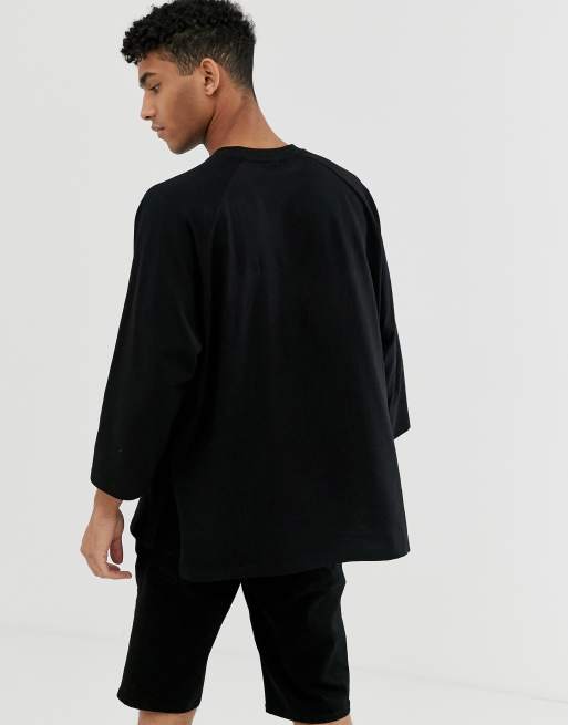 ASOS DESIGN oversized raglan t-shirt with wide sleeves in black | ASOS