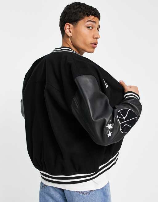 ASOS DESIGN oversized varsity jacket with real leather sleeves in green