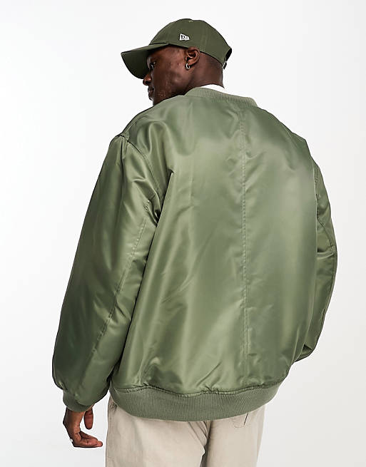 ASOS DESIGN oversized reversible borg lined bomber jacket in green