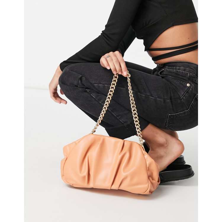 ASOS DESIGN oversized ruched clutch bag in apricot with detachable shoulder chain