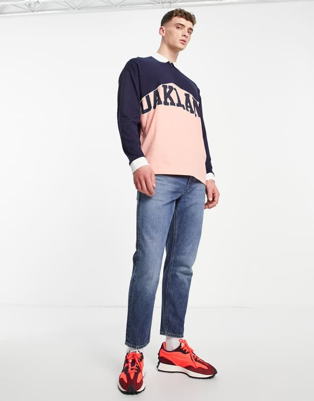 ASOS DESIGN oversized rugby polo shirt in navy color block with Oakland city print
