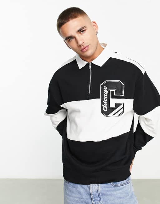 ASOS DESIGN - Oversized rugby poloshirt met varsity-badge en strepen in zwart en wit