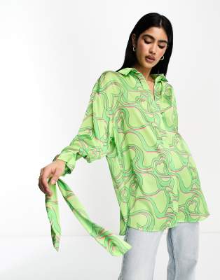 Shop Asos Design Oversized Satin Shirt With Tie Cuff Detail In Green Heart Print-multi