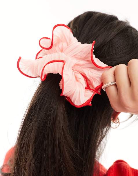 Crystal and pearl trim on a pink elastic headband