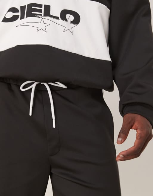 ASOS DESIGN oversized scuba-style fabric shorts with print in black co ord, 5 of 5