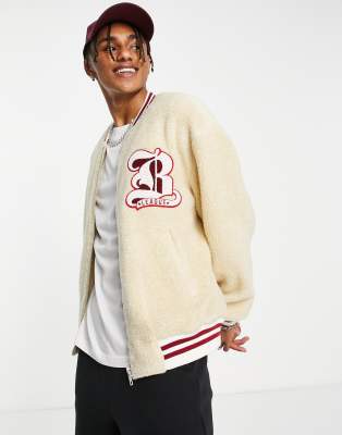 ASOS DESIGN oversized varsity bomber jacket in green and ecru cotton