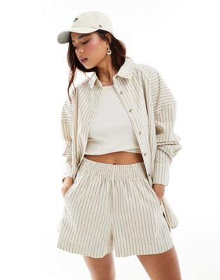 ASOS DESIGN oversized shirt with cutabout panels in structured stripe