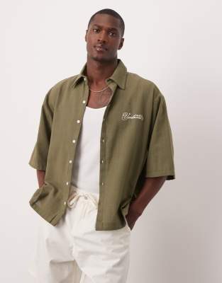 asos ASOS DESIGN oversized short sleeved shirt with chest embroidery detail in khaki linen look