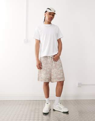 ASOS DESIGN oversized short with all over foliage print in beige | ASOS