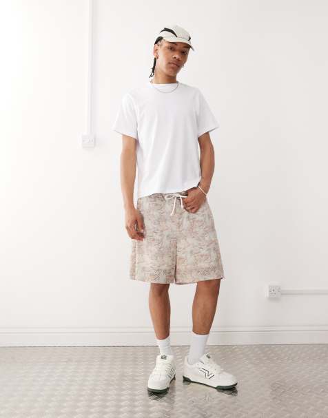ASOS DESIGN oversized short with all over foliage print in beige - view 1