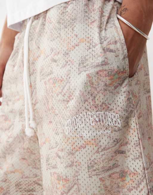 ASOS DESIGN oversized short with all over foliage print in beige