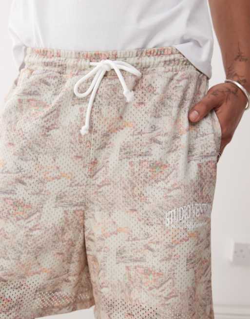 ASOS DESIGN oversized short with all over foliage print in beige