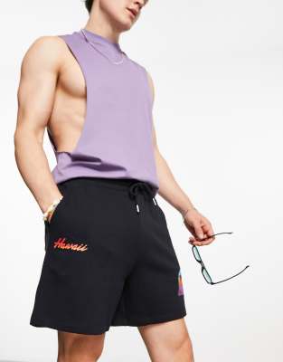 oversized shorts in black with multiplacement palm tree print