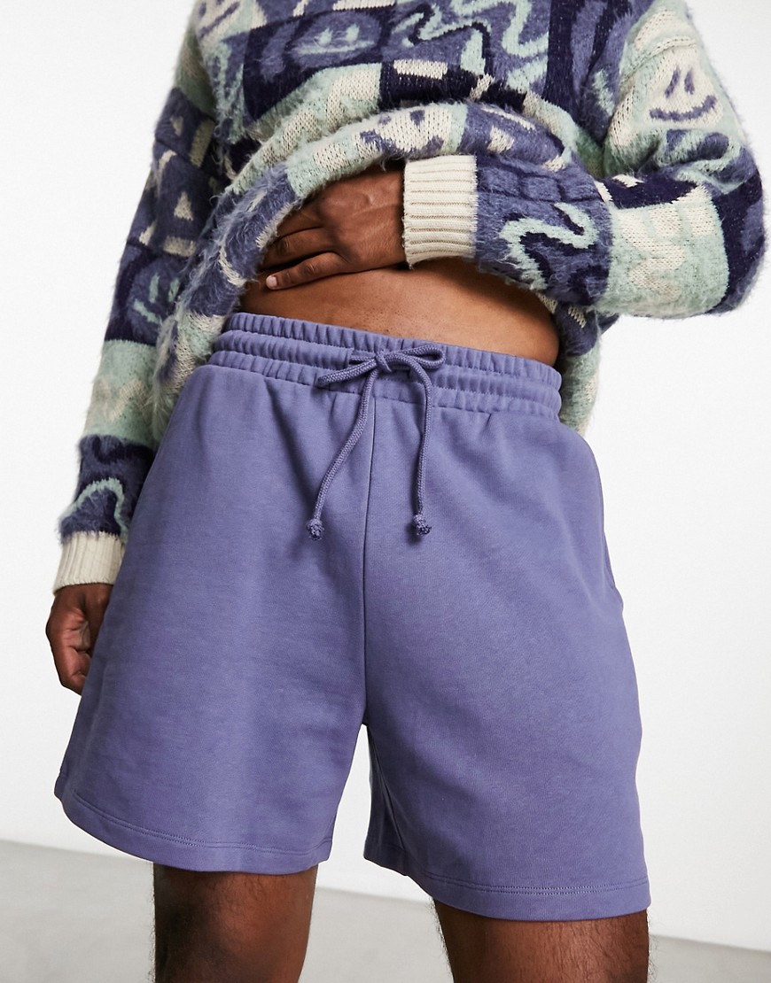 ASOS DESIGN oversized shorts in purple with text print-Navy