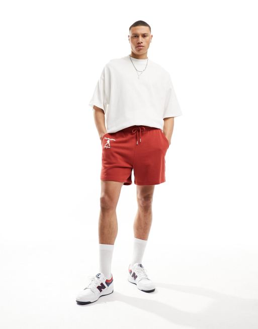 ASOS DESIGN oversized shorts in red with collegiate print