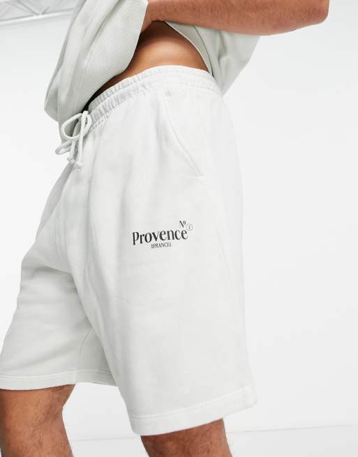 ASOS DESIGN oversized shorts in washed white cotton with city print - WHITE