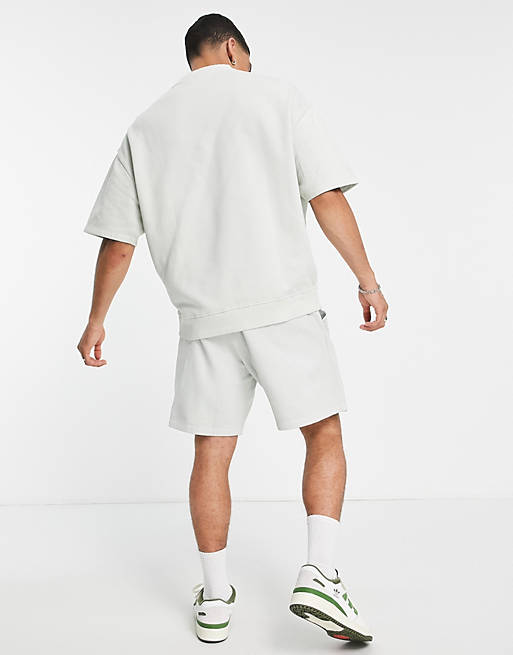 Shorts oversized shorts in washed white organic cotton with city print 