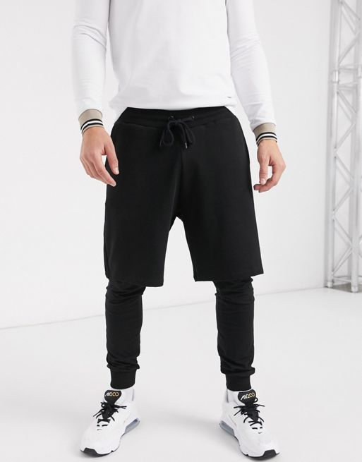 ASOS DESIGN oversized shorts with trackie underlayer in black | ASOS