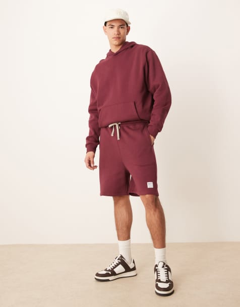 ASOS DESIGN oversized shorts with woven badge in burgundy - part of a set - view 1