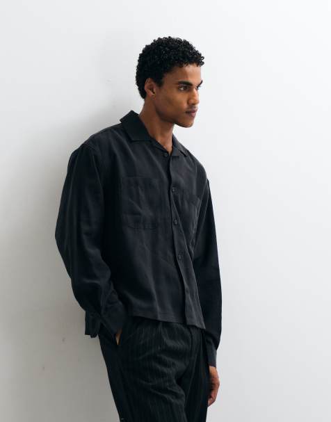 ASOS DESIGN oversized skjorta med asymmetrisk fåll och fickbroderi i svart - view 1
