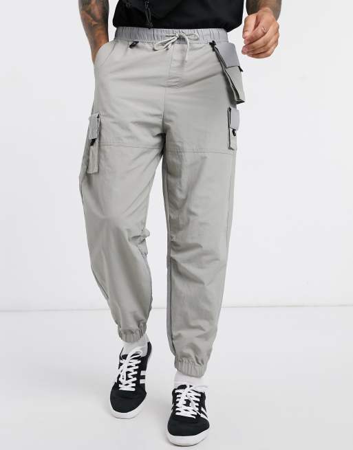 ASOS DESIGN - Oversized smaltoelopende joggingbroek met afneembare zakken in grijs