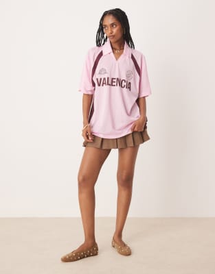 ASOS DESIGN oversized soccer shirt with Valencia graphic in pink