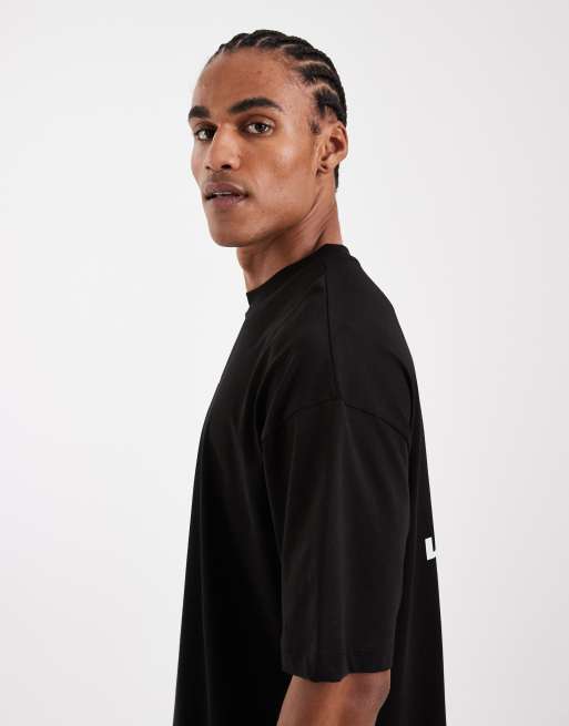 ASOS DESIGN - Oversized sort T-shirt med blomsterprint på brystet , 4 af 5