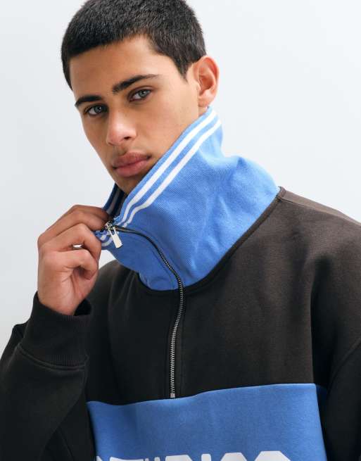 ASOS DESIGN oversized spread collar half zip sweatshirt with contrast rib, cut & sew panel and print in brown and blue, 4 of 5