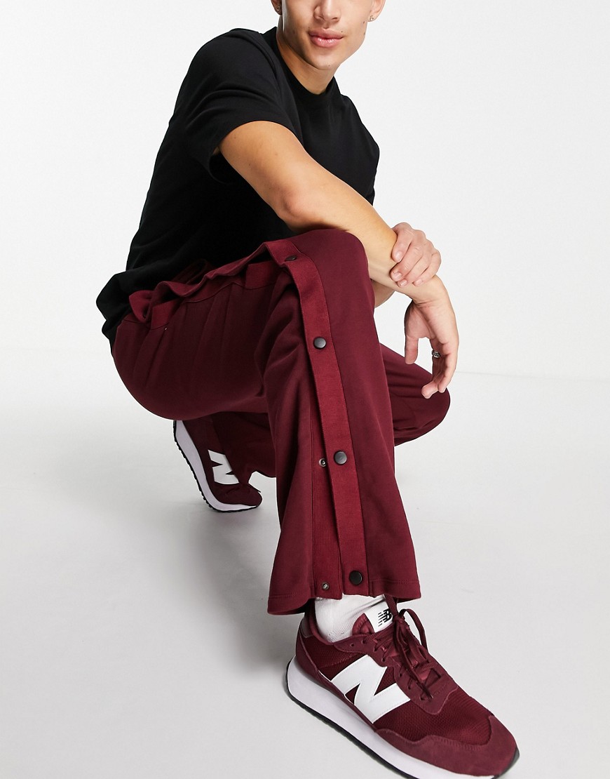 ASOS DESIGN oversized straight leg sweatpants with snaps in burgundy - part of a set-Red