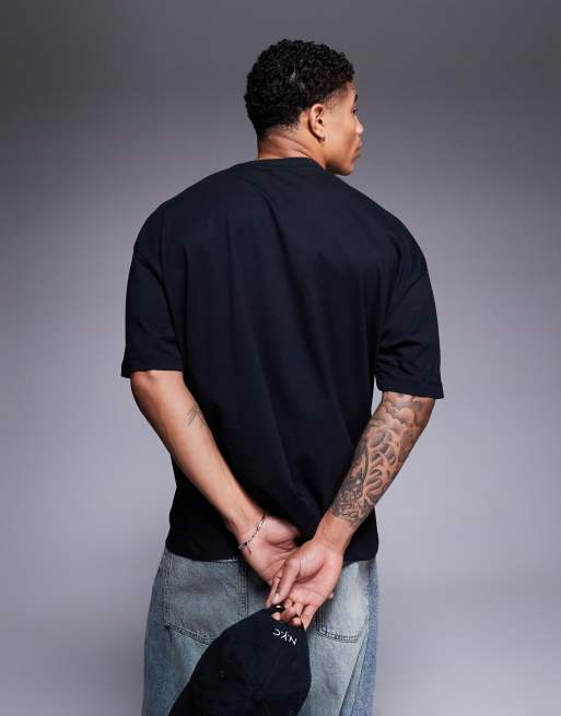 ASOS DESIGN oversized striped T-shirt with soccer graphic in black , 3 of 4