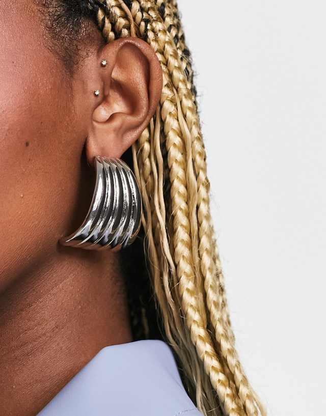 ASOS DESIGN oversized stud earring with curved design in silver tone