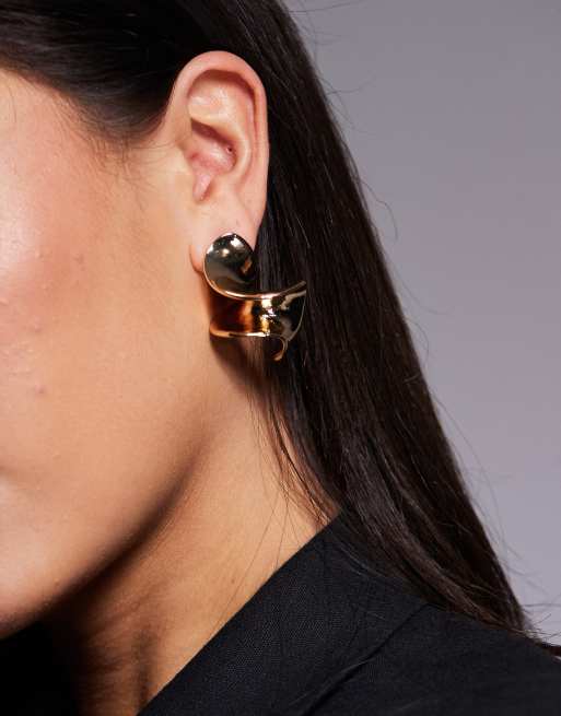 ASOS DESIGN oversized studs with abstract twist detail in gold tone