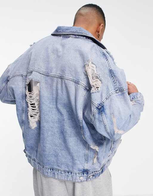 ASOS DESIGN oversized super ripped denim jacket in mid lightwash blue