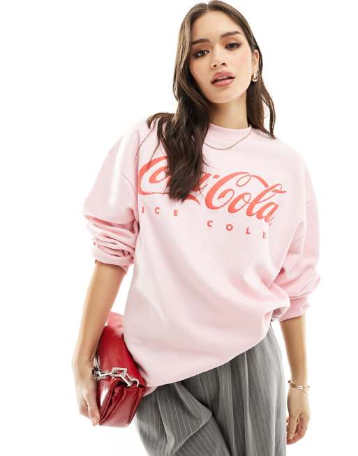 ASOS DESIGN oversized sweat with coca cola licence graphic in pink