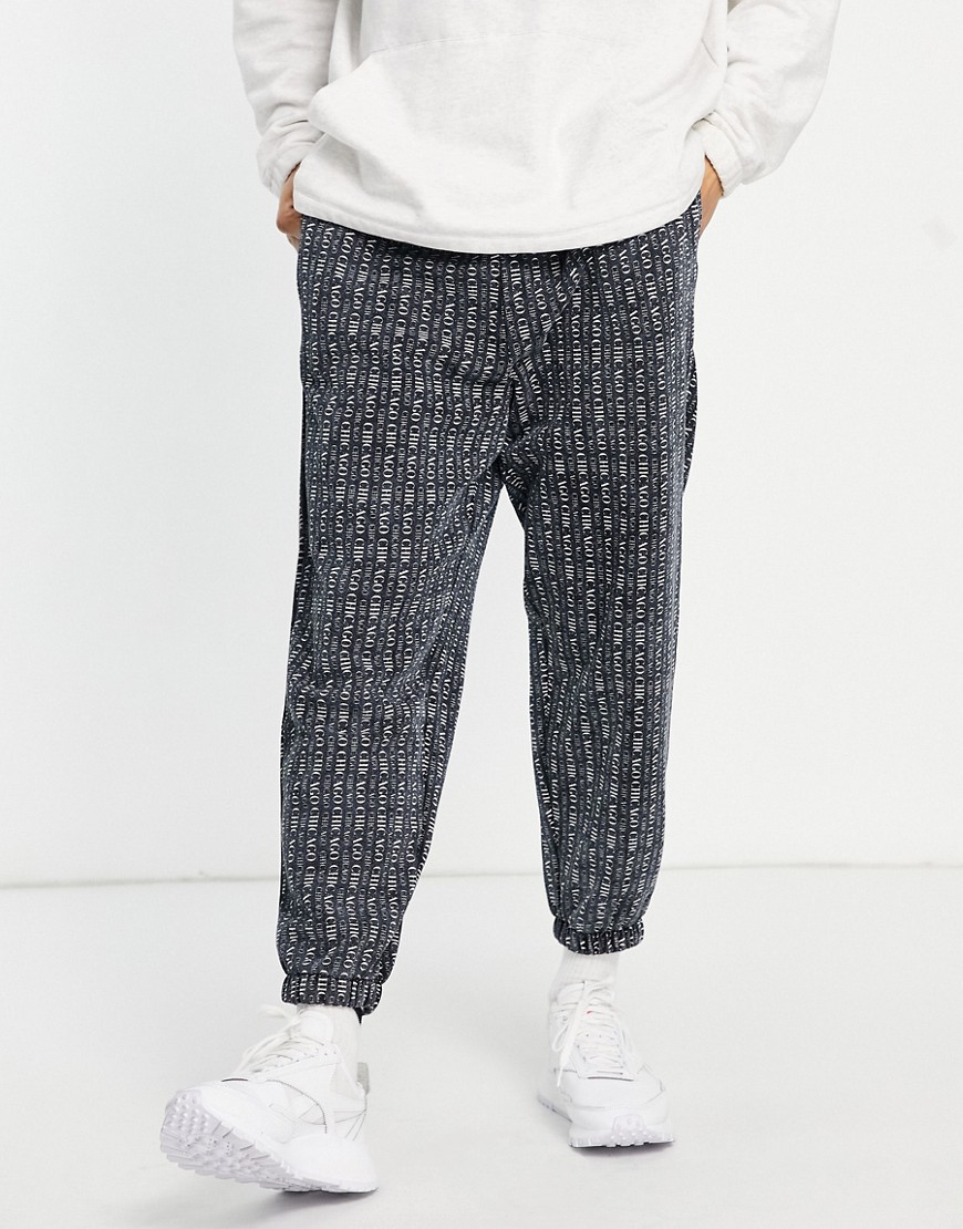 ASOS DESIGN oversized sweatpants in black with all over Chicago city print