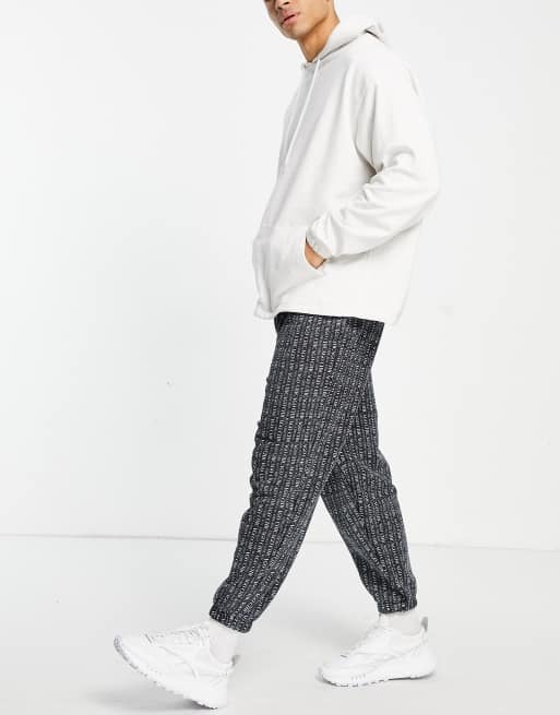 ASOS DESIGN oversized sweatpants in black with all over Chicago city print, 4 of 4