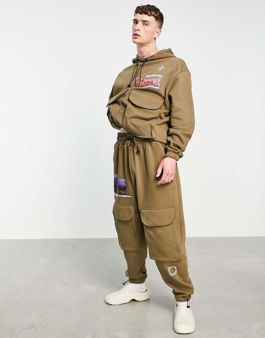 ASOS DESIGN oversized sweatpants in brown with cargo pockets and mountain prints - part of a set