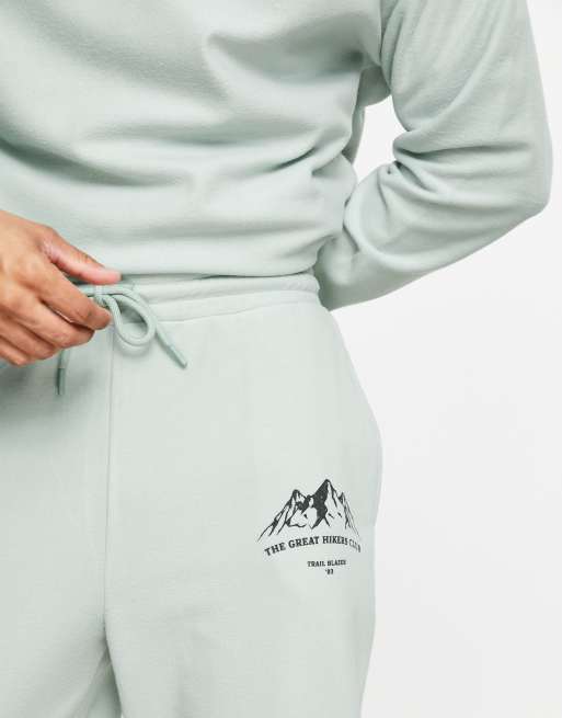 ASOS DESIGN oversized sweatpants in green polar fleece with mountain print ASOS