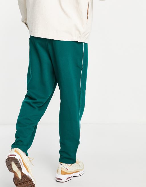 EMBROIDERED LOGO PIPING SWEAT PANTS