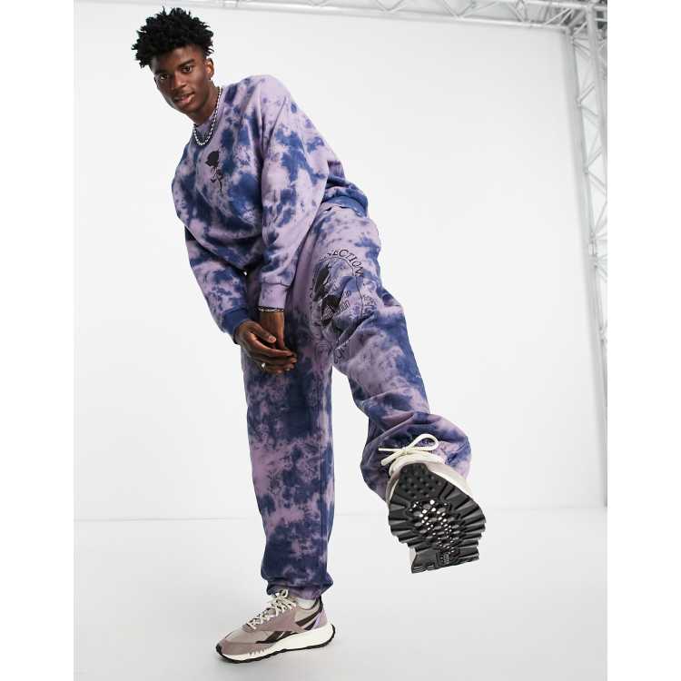 ASOS DESIGN oversized sweatpants in purple tie dye with rose print