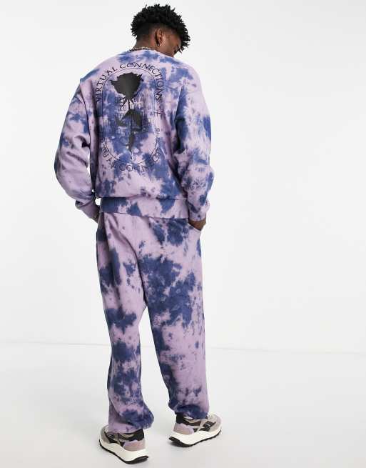 ASOS DESIGN oversized sweatpants in purple tie dye with rose print part of a set