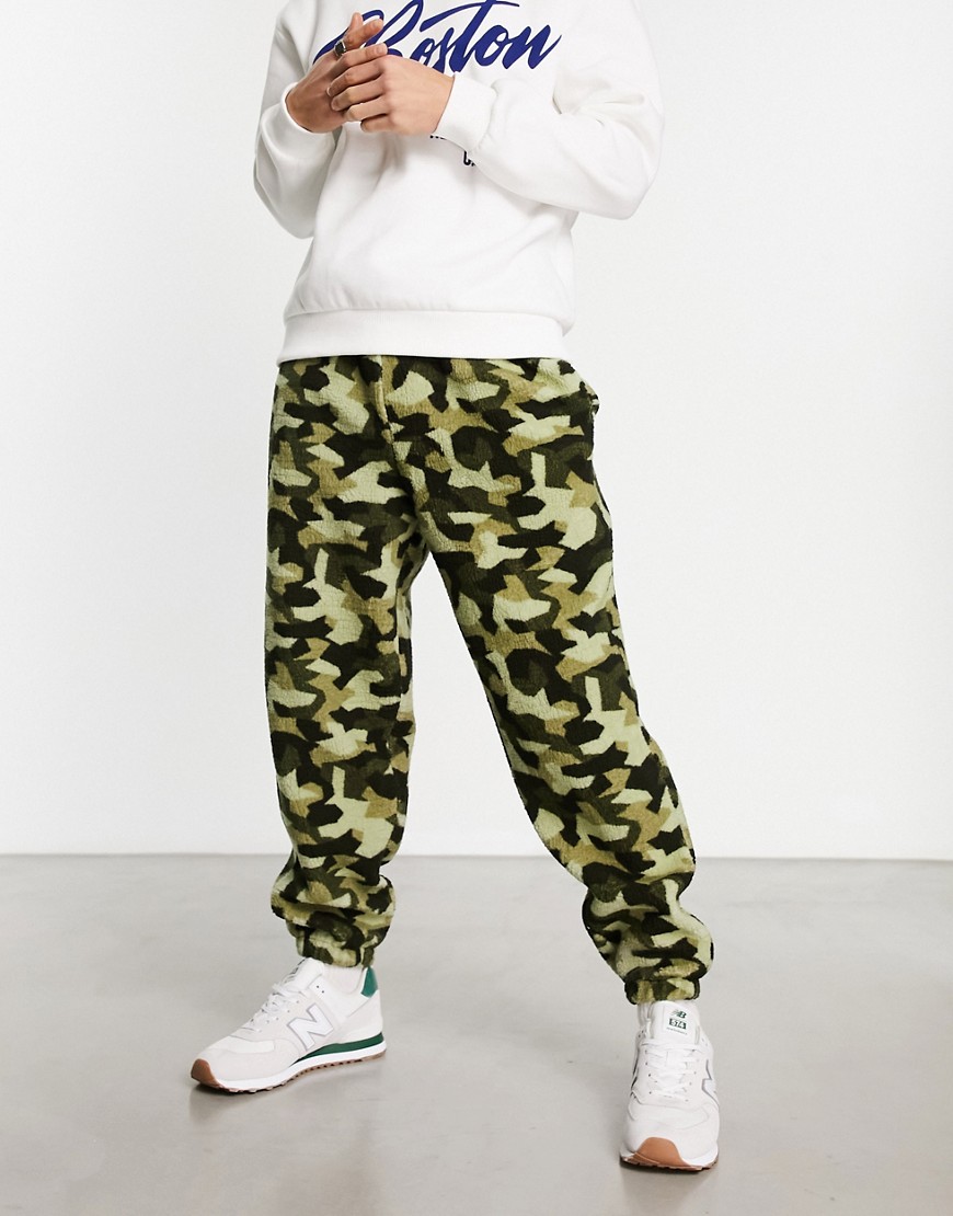 ASOS DESIGN oversized sweatpants in teddy with camo all over print-Green