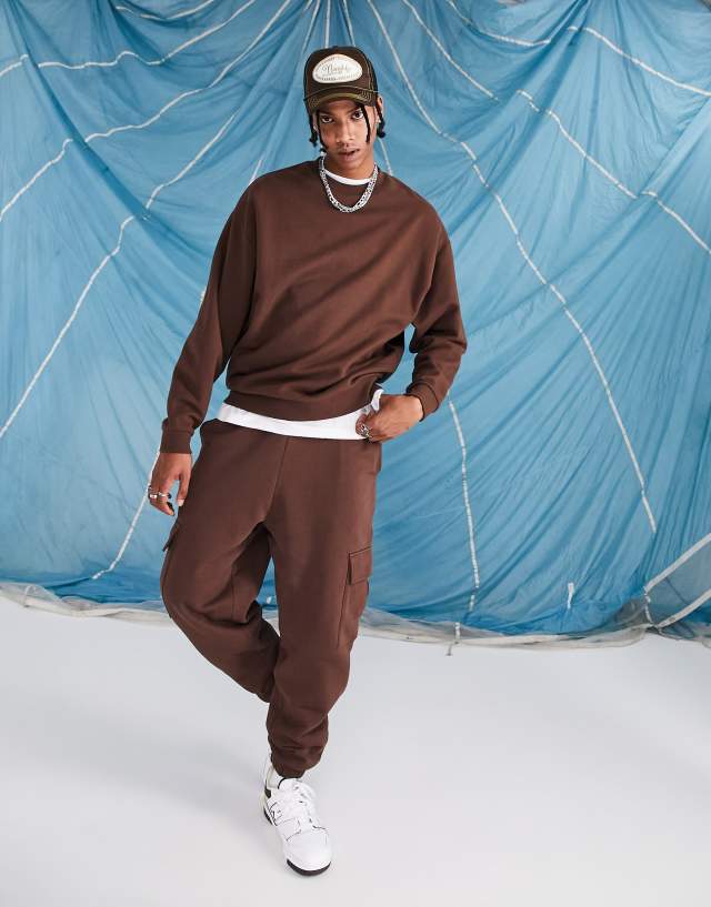 ASOS DESIGN oversized sweatpants with cargo pocket in chocolate brown