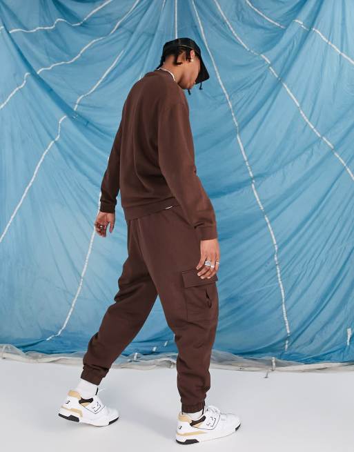 ASOS DESIGN oversized sweatpants with cargo pocket in chocolate brown