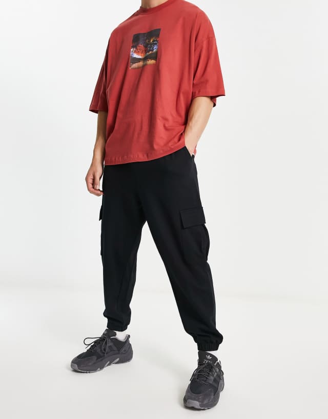 ASOS DESIGN oversized sweatpants with cargo pockets in black