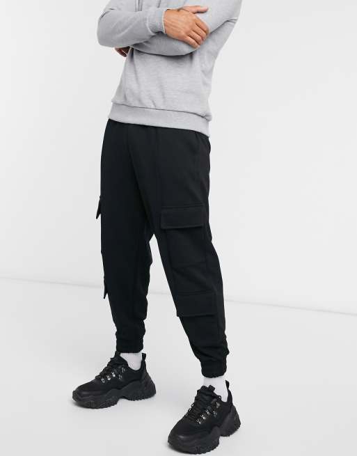 ASOS DESIGN oversized sweatpants with cargo pockets in black | ASOS